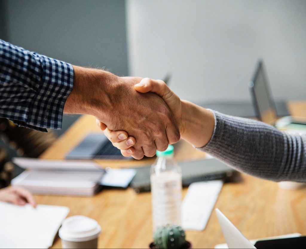 close up of two hands in a handshake