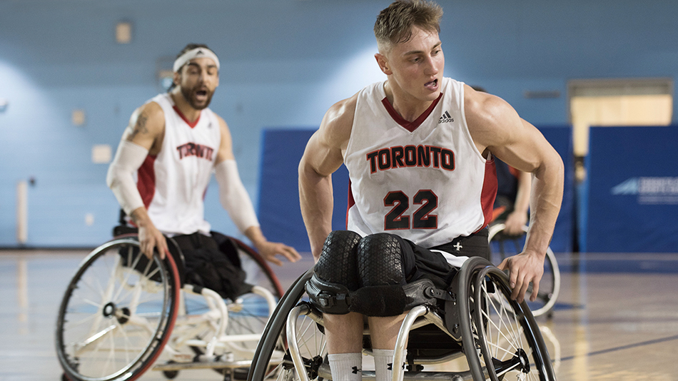 Jesse Heuberman in his Rolling Raptors uniform with another player