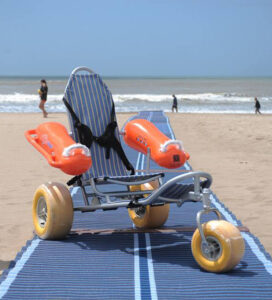 Beach wheelchair on sand mat