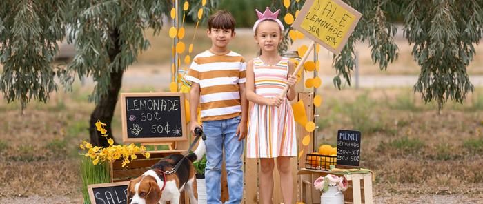 two children selling homemade lemonade