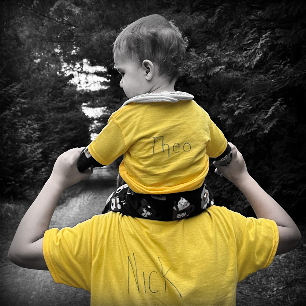 Baby Theo on dad Nick's Shoulders