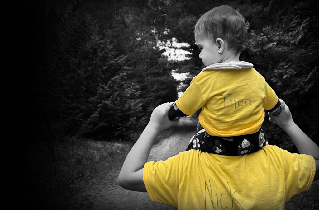 Baby Theo on dad Nick's Shoulders