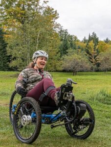Woman smiling using adaptive mountain bike