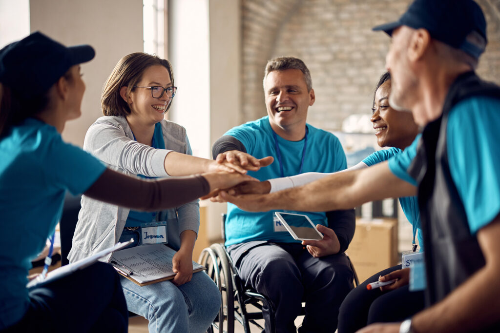 diverse team of people stack hands