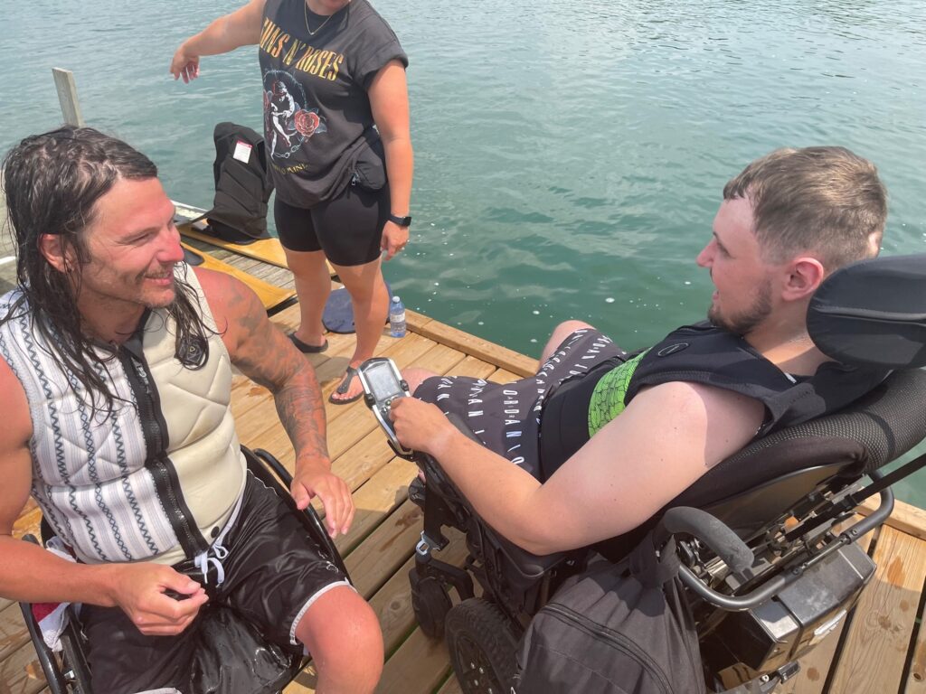 two people preparing to waterski